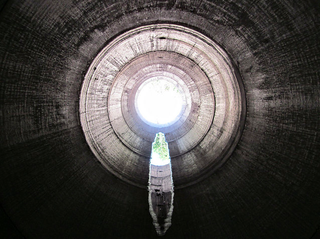 Illustration for article titled Unreal photographs of tunnels look like portals into the underworld